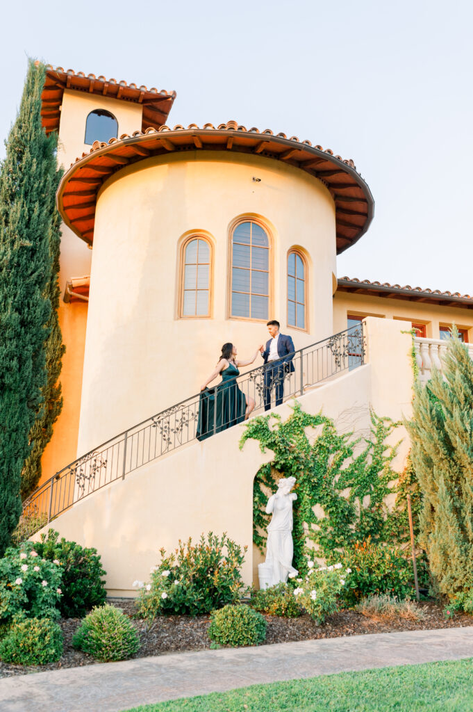 Couple posing on the tower at Villa San Juliette Vineyard - winery engagement